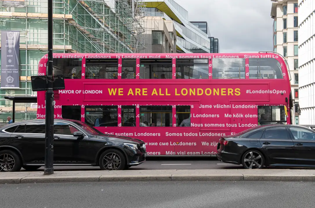 A London bus clad in the campaign slogan 'We are all Londoners' in 24 languages